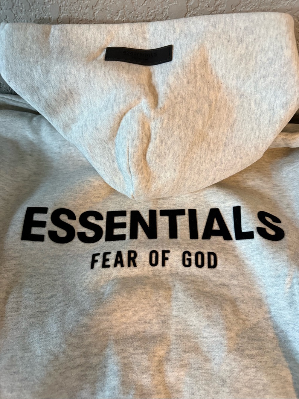 Fear of God Essentials Light Gray Hooded Sweatshirt with Black Logo
